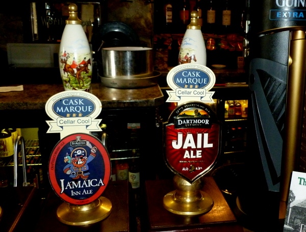 Bar taps for Jail Ale and Jamaica Inn Ale at the historic Jamaica Inn pub on Bodmin Moor, Cornwall.