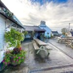 Pub garden with benches outside The Old Inn, St Breward on Bodmin Moor, Cornwall.