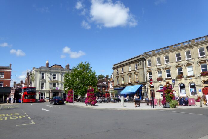 Wimborne Minster town square with surrounding pubs in Dorset