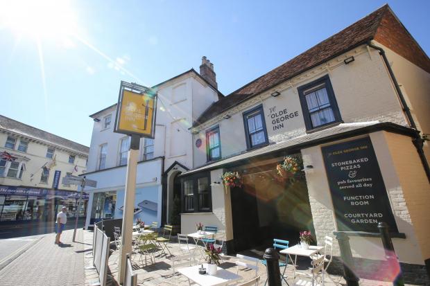 Front view of Ye Olde George Inn in Christchurch, Dorset, one of the county's most historic and reportedly haunted pubs