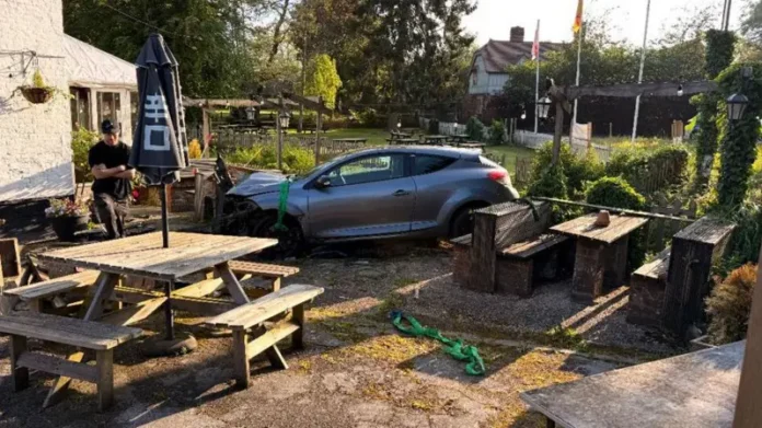 Police at the scene after a car crashed into a pub in the New Forest