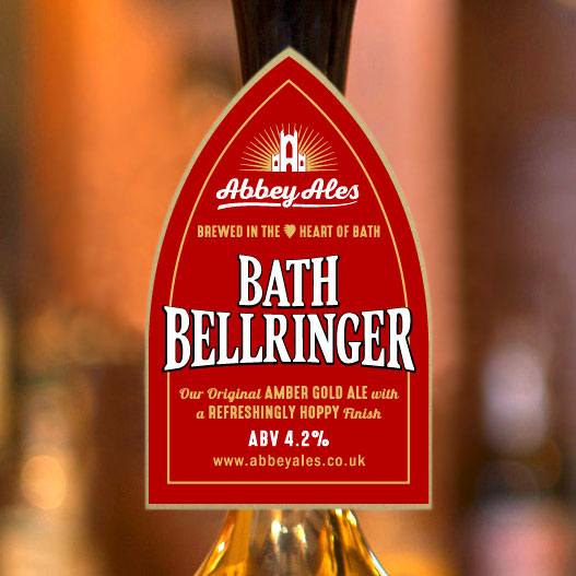 A freshly poured pint of Bellringer in a traditional ale glass with a clear golden hue and a creamy white head.