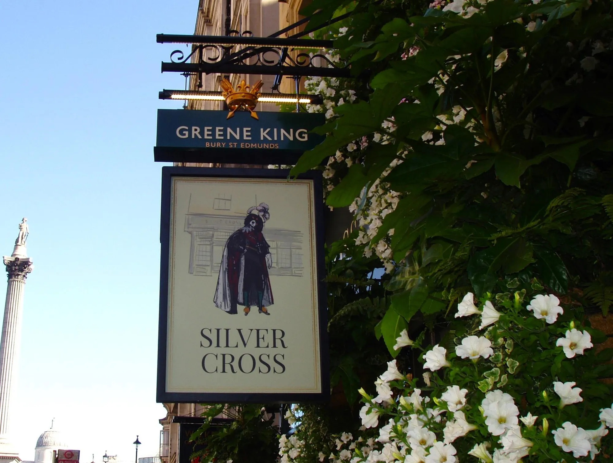 Silver Cross pub sign on Whitehall in London featuring King Charles II and a King Charles Spaniel outside the historic Westminster pub.